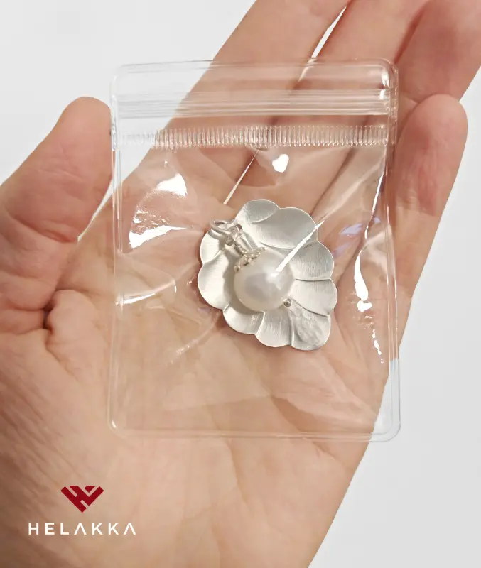 Helakka Hopeakorun säilytyspussi